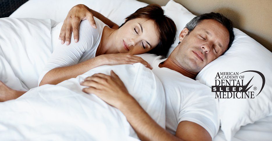 Man and woman sleeping soundly thanks to sleep apnea treatment