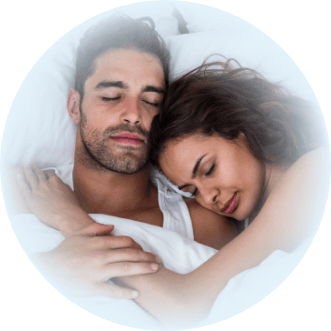 Man and woman sleeping soundly thanks to sleep apnea treatment