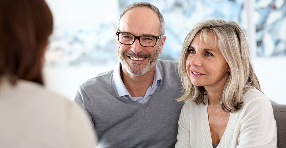 Man and woman discussing insurance coverage for sleep apnea treatment