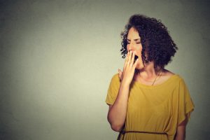 Young woman yawning