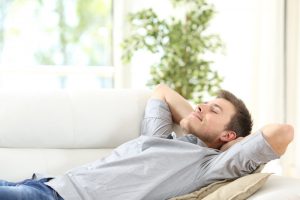 man resting on the sofa