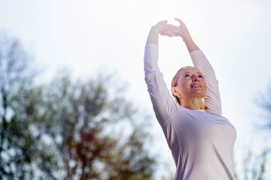 A woman stretches in the morning 