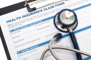 stethoscope on insurance claim form