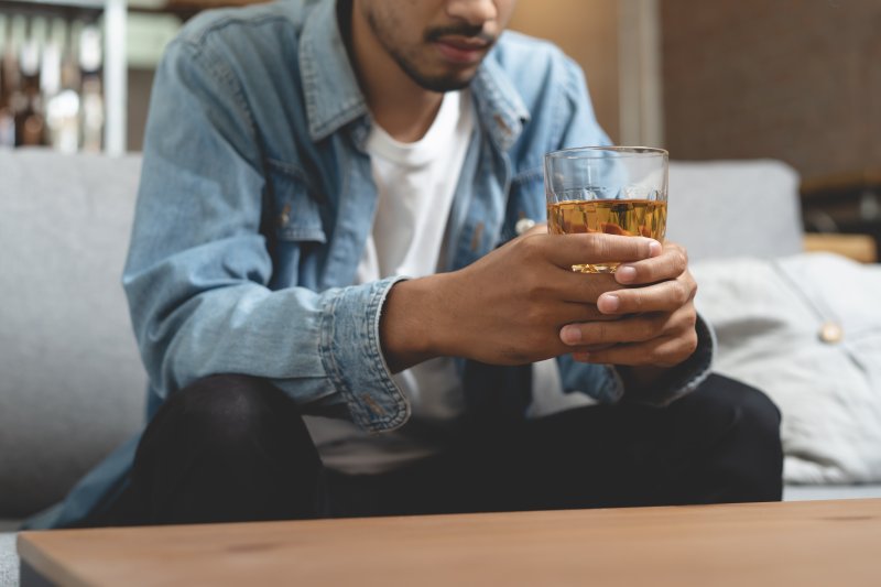 young man drinking alcohol