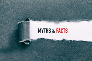 Myths & Facts under torn paper