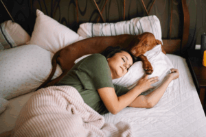 a person and their dog napping